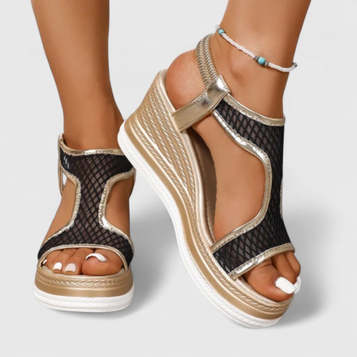 Stylish orthopaedic wedge sandals with arch support, ideal for women's casual footwear.