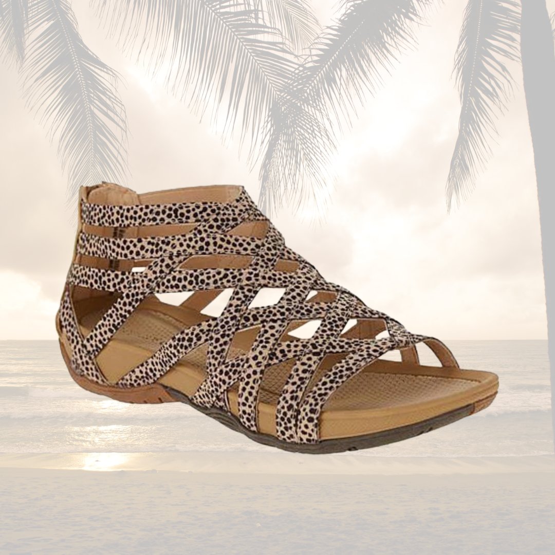 Comfortable women's flat sandals with orthopedic features & adjustable strappy design.