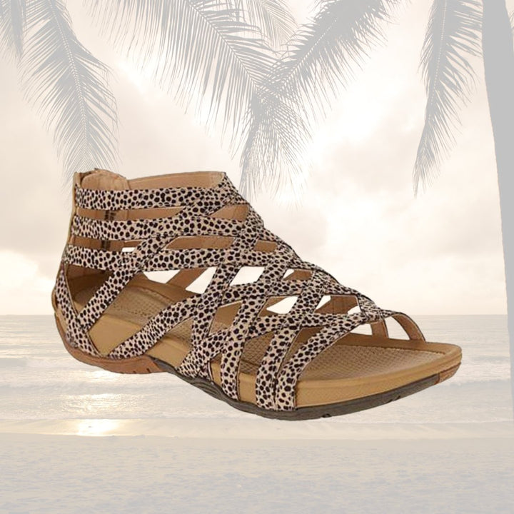 Comfortable women's flat sandals with orthopedic features & adjustable strappy design.