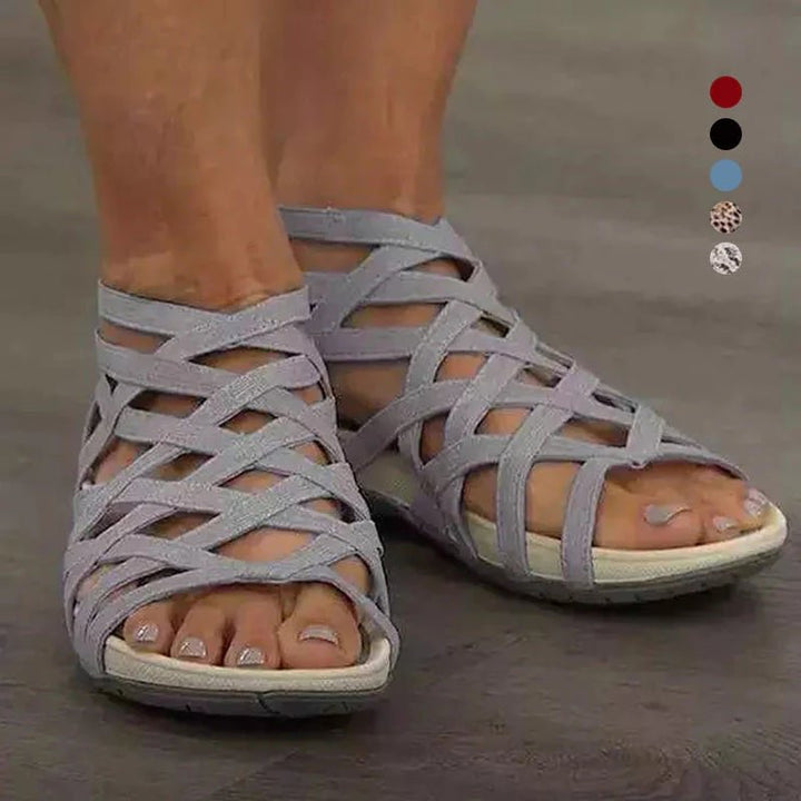 Adjustable strappy flat sandals for women, offering orthopedic arch support & casual elegance.
