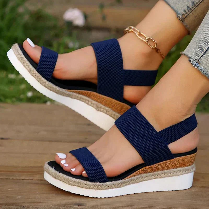 Cushioned women's espadrille sandals with orthopedic features, secure ankle strap, and platform heel.