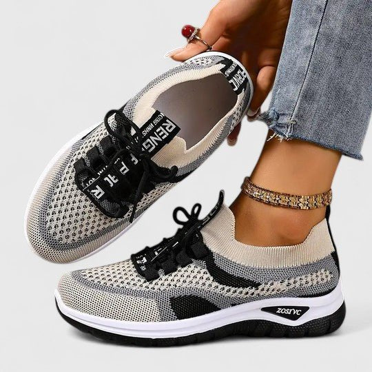 Breathable multi-color women's lace-up trainers, orthopedic with arch support for active comfort.