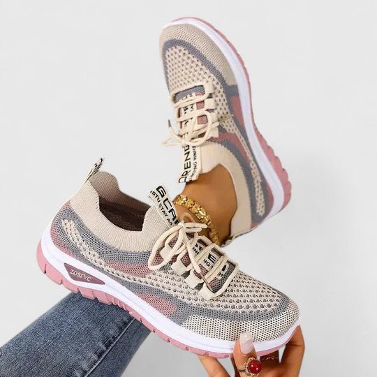 Breathable women's athletic trainers featuring orthopedic arch support for active lifestyles.