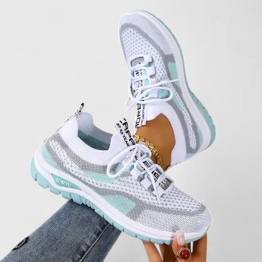 Lace-up women's orthopedic trainers, designed for arch support, breathability, and walking comfort.