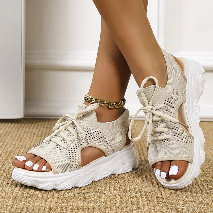 Active women's cushioned orthopedic sandals, lace-up design providing arch support & all-day comfort.