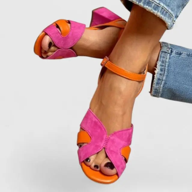 Pink women's orthopedic block heel sandals. Stylish comfort with foot support and adjustable ankle strap for all-day wear.