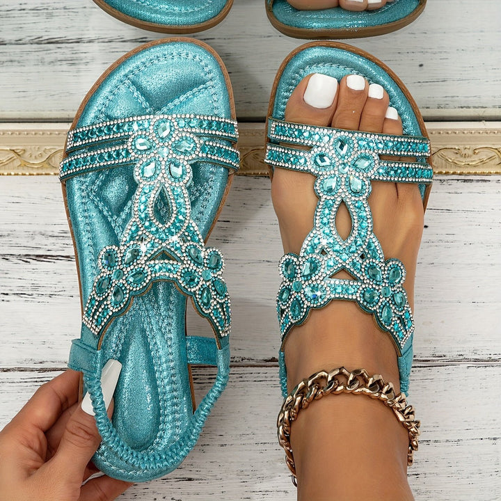 Stylish women's orthopedic summer sandals, flat design, featuring boho embellishments for comfort.