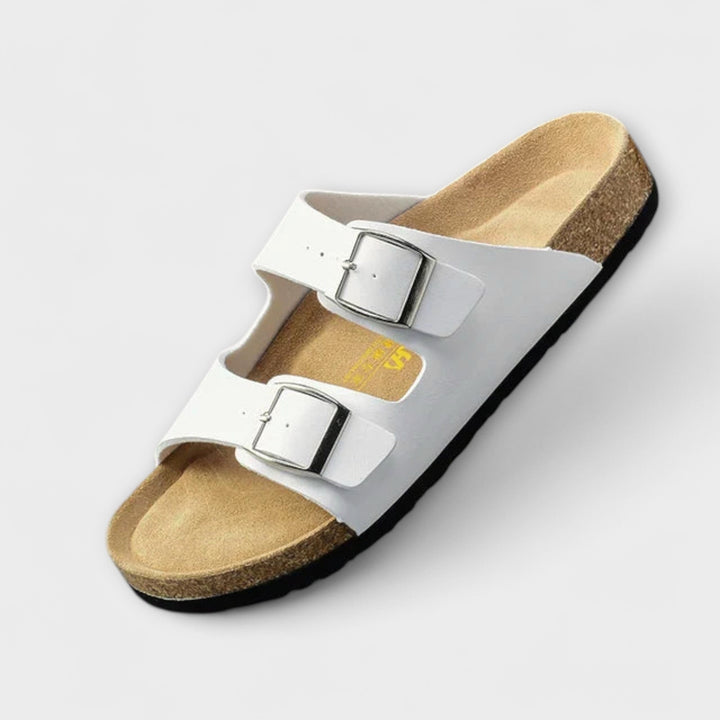 Woman walking in breathable, durable orthopedic flat sandals, perfect for summer adventures & comfort.