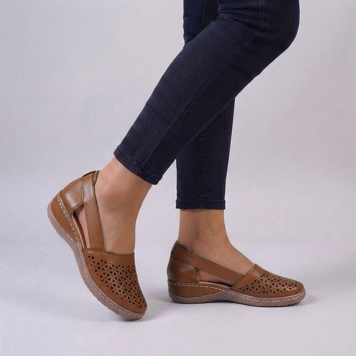 Supportive women's orthopedic sandals, ideal for all-day comfort with stylish scalloped cut-outs & open toe.