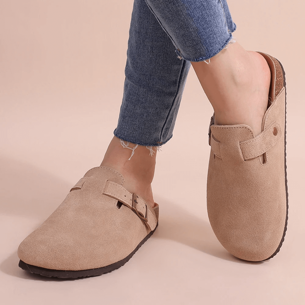 Women's orthopedic comfort slippers, soft slip-on design for all-day arch support & foot pain relief.