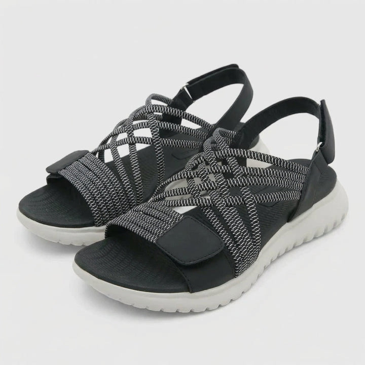 Stylish women's orthopedic criss-cross sandals, offering superior comfort for casual and everyday wear.
