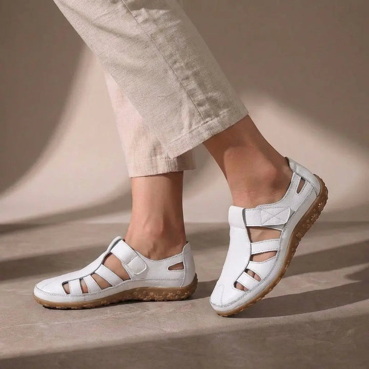 Supportive women's orthopedic fisherman sandals. Closed toe with cutout design, ideal for casual summer style.