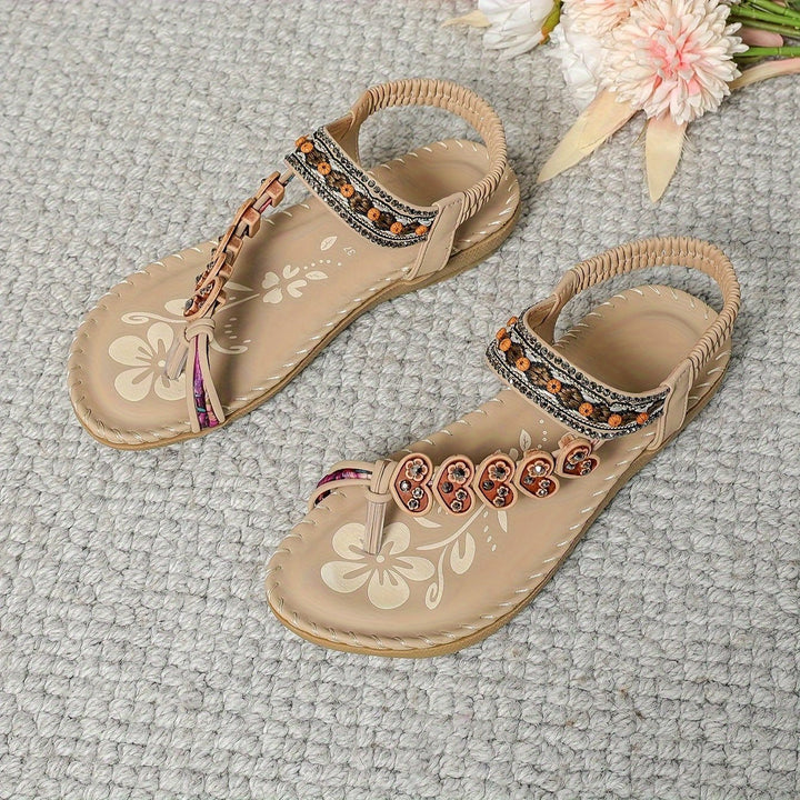 Comfortable women's orthopedic flat sandals with ankle strap, perfect for long summer days.