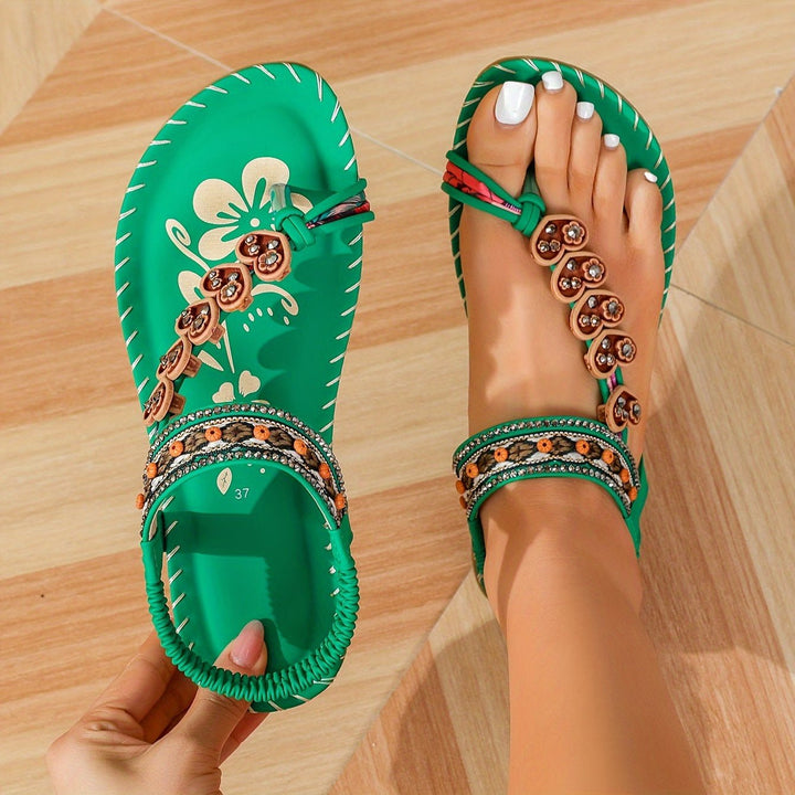 Fashionable women's orthopedic flat sandals with ankle strap, combining style with foot support.