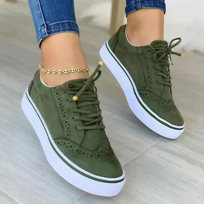 Elegant women's wingtip oxfords with orthopedic design, lace-up closure & arch support for comfort.