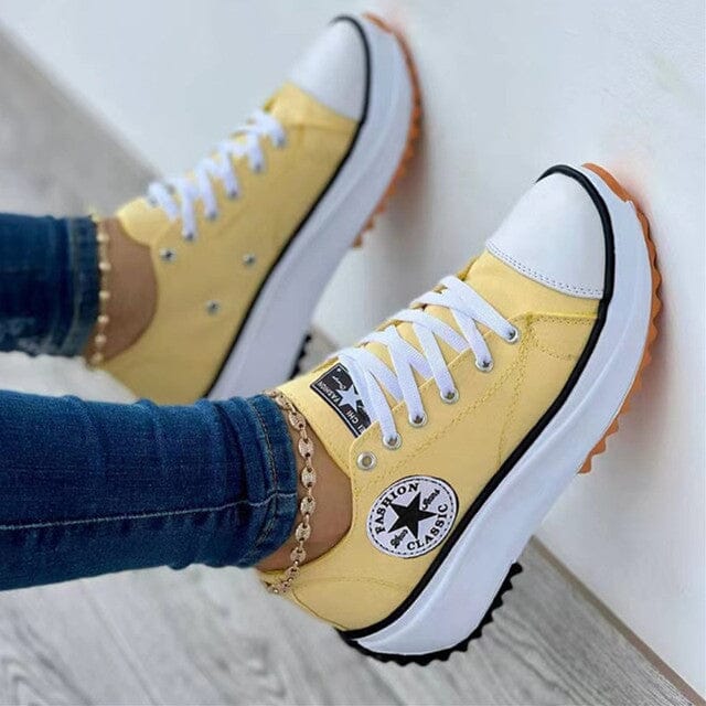 Comfortable white women's everyday sneakers with supportive ergonomic design, ideal for active walking.