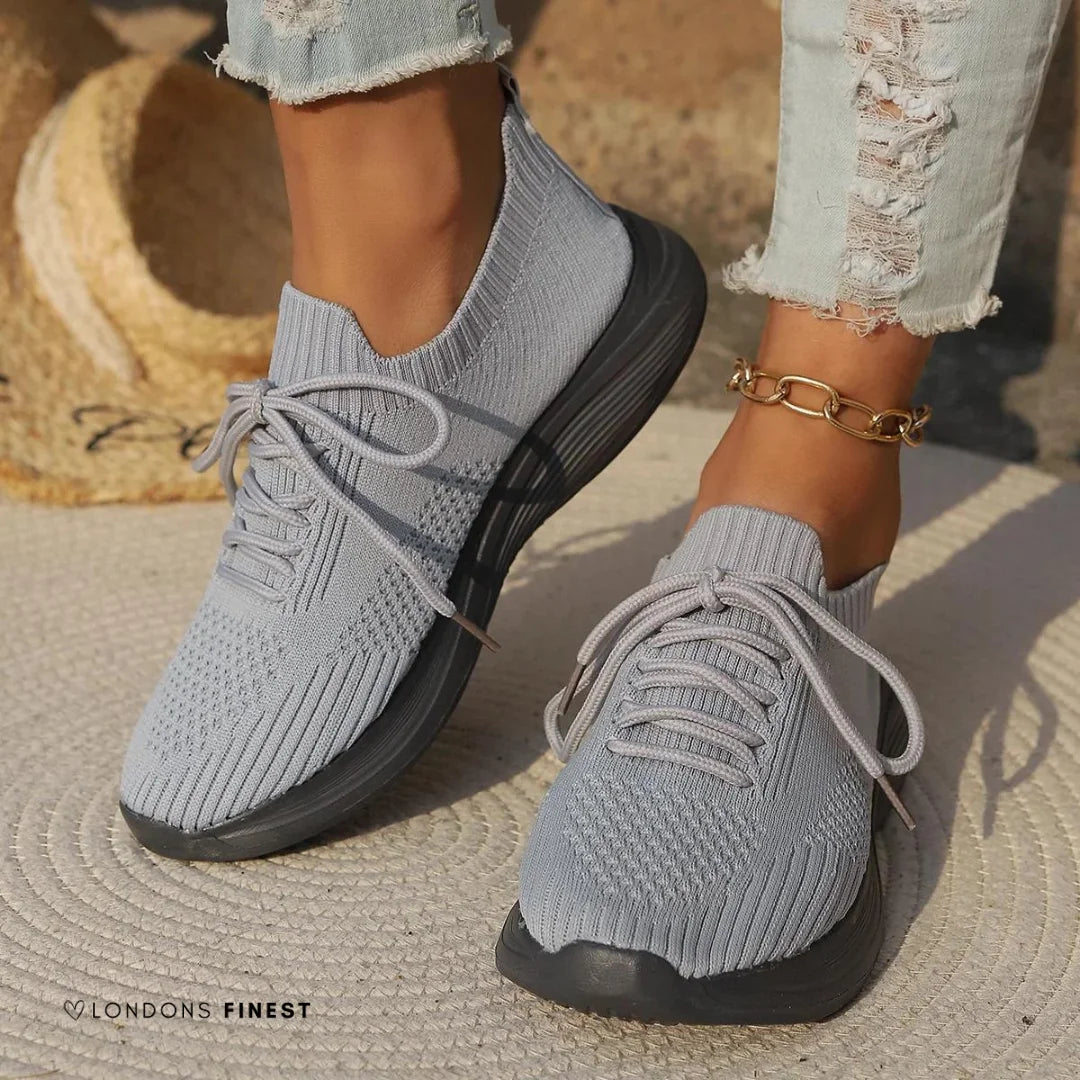 Comfortable women's orthopedic walking shoes, featuring a supportive lace-up design & sock-like ankle.