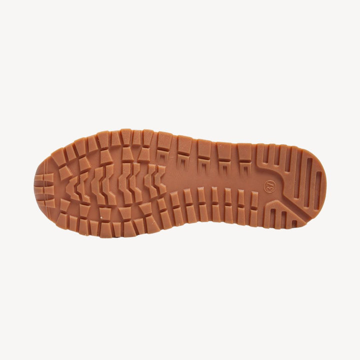Close-up of women's orthopedic loafers with chic gold chain detail, offering comfortable, supportive daily wear.