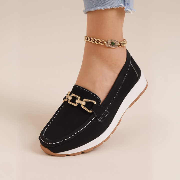 Fashionable women's orthopedic slip-on loafers with elegant chain, perfect for comfortable and stylish daily wear.