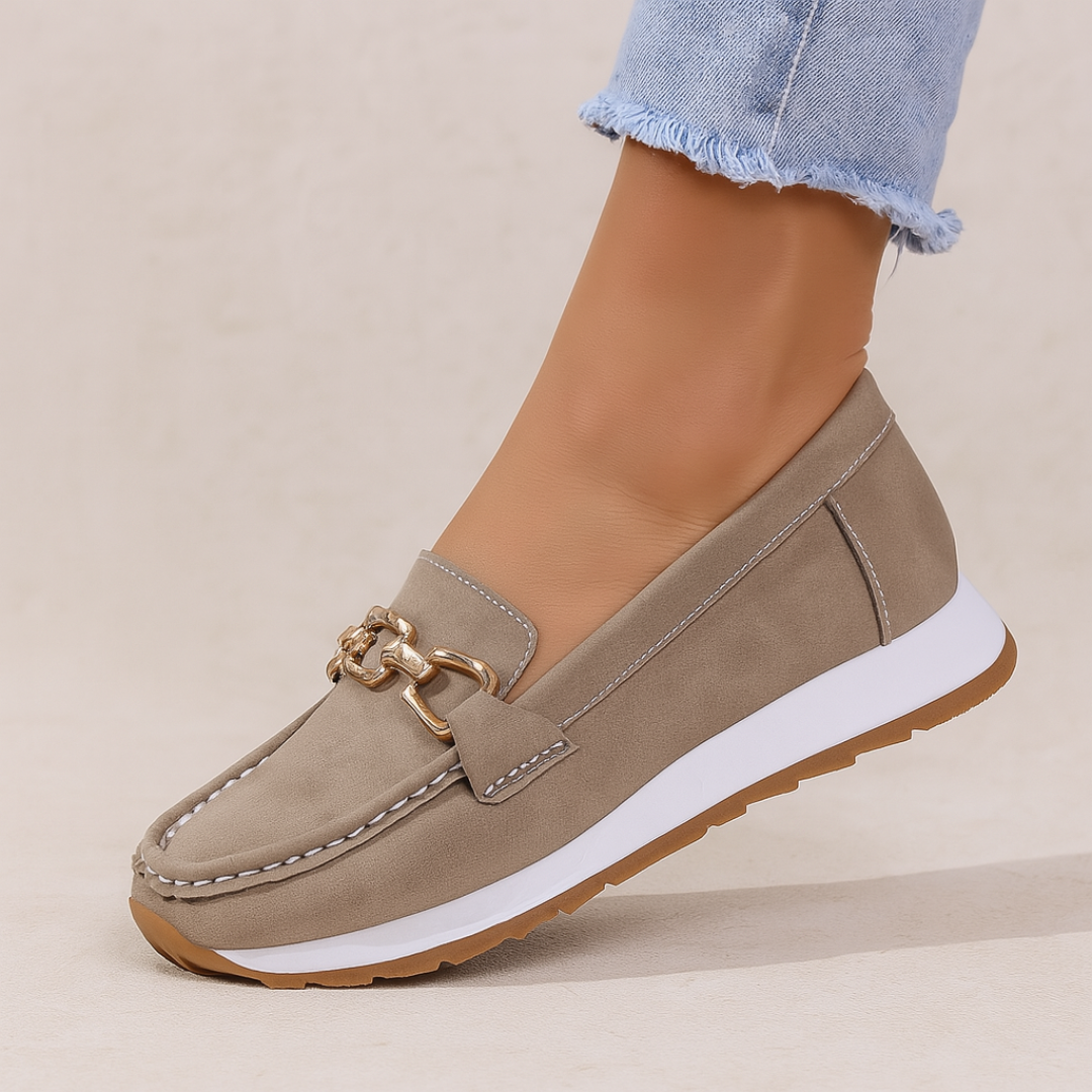 Supportive women's orthopedic loafers, designed for comfortable daily wear, featuring an elegant chain detail.
