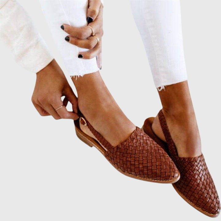 Ergonomic woven mules for women, providing arch support and all-day comfort.
