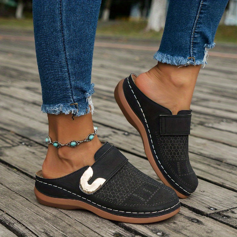 Relaxed fit women's orthopedic comfort slippers. Non-slip design for secure indoor wear.
