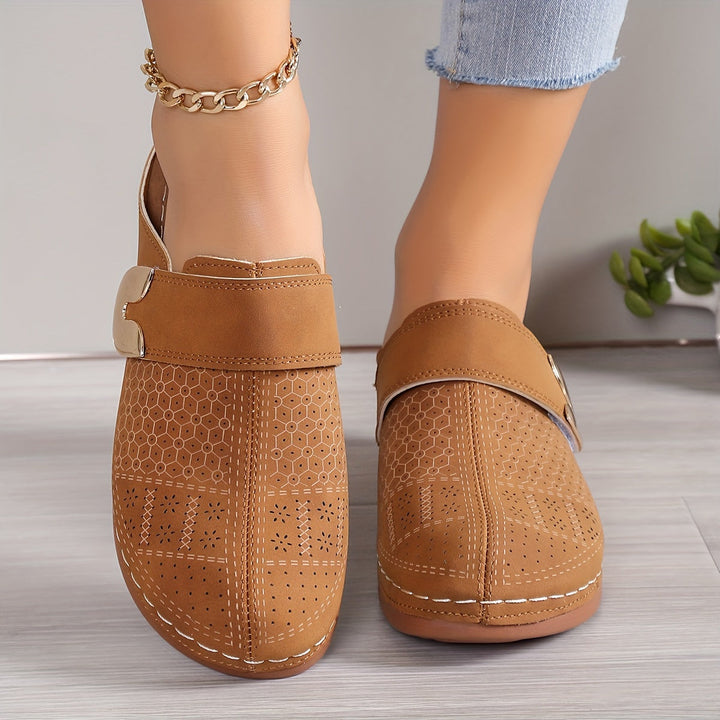 Soft, plush women's orthopedic slip-on slippers with non-slip sole for ergonomic home comfort.