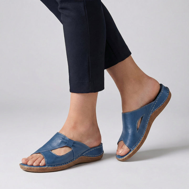 Close-up of supportive women's orthopedic open-toe slides, designed for ultimate comfort and daily walking.
