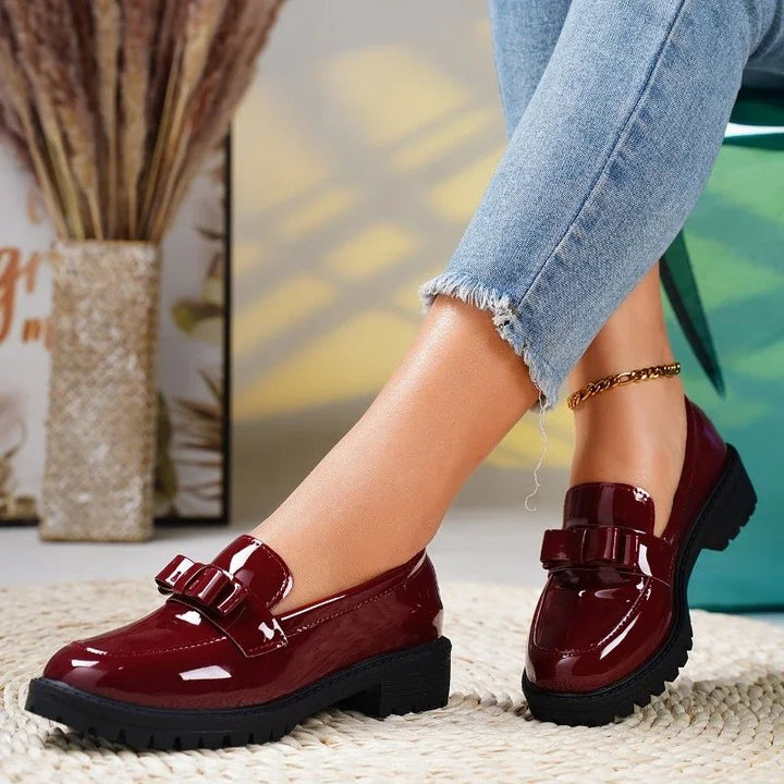 Comfortable women's orthopedic patent leather loafers with a stylish bow & chunky sole. Slip-on shoes.