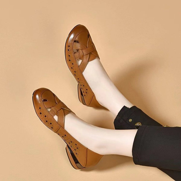 Perforated women's orthopedic walking shoes, easy slip-on style, closed toe for breathable everyday comfort.