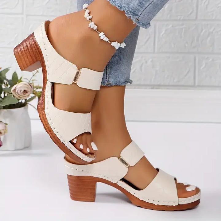 Quilted women's orthopedic sandals with a stylish block heel and supportive platform.