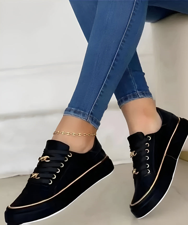 Stylish women's platform lace-up trainers. Fashionable orthopedic sneakers featuring chic gold detailing and comfort.