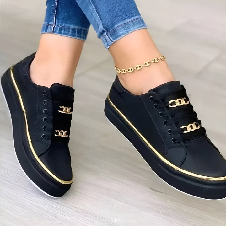 Comfortable gold-accent women's fashion trainers. Orthopedic platform lace-up sneakers, perfect for casual footwear.