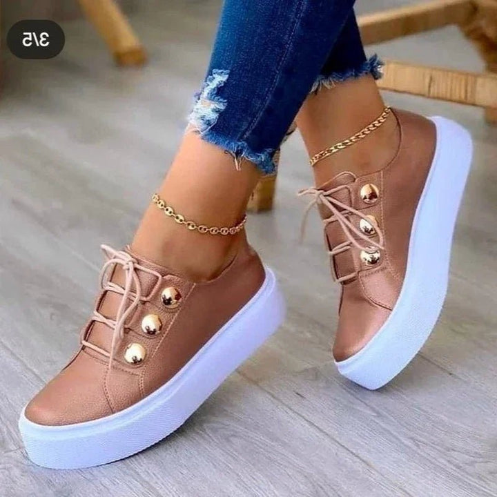 Everyday women's lace-up trainers with orthopedic foot support, platform design, and trendy gold stud detailing.