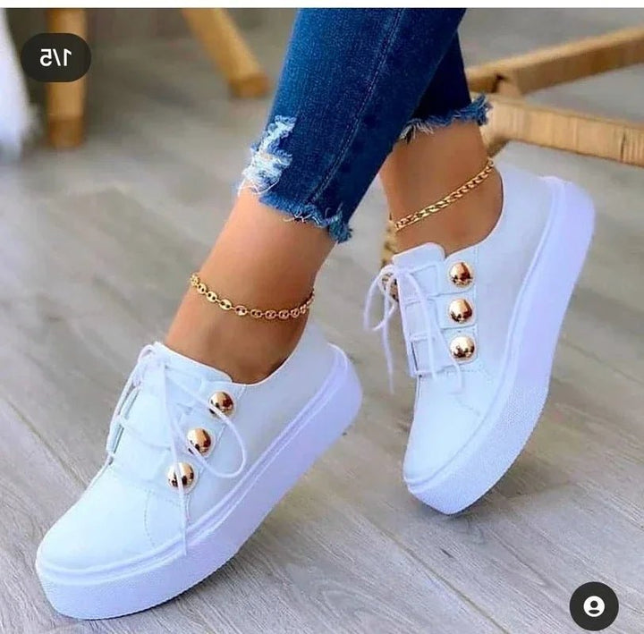 Women's gold stud platform trainers. Orthopedic lace-up sneakers with chunky soles for comfort and style.