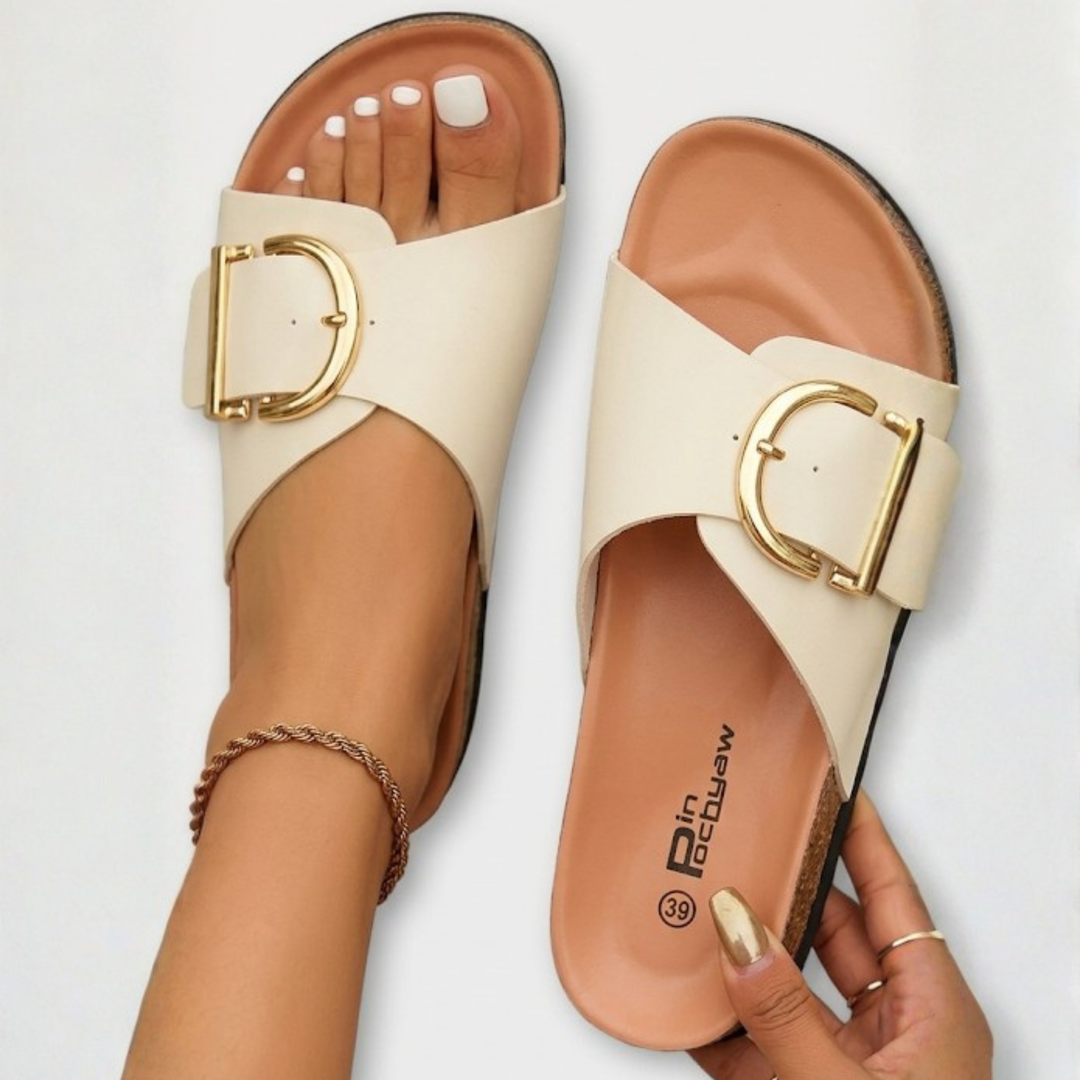 Everyday women's orthopedic sandals in creme with a supportive sole and comfortable adjustable buckle design.
