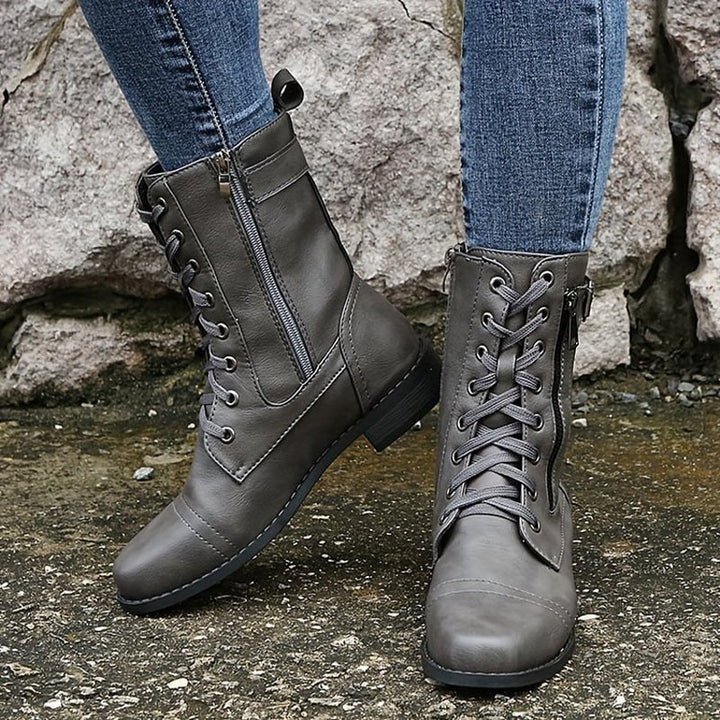 Modern women's side zip ankle boots, orthopedic design for stylish all-day comfort.