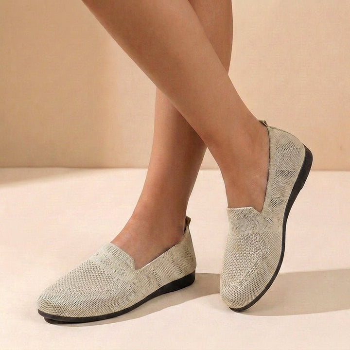 Supportive women's orthopedic slip-on comfort flats with round toe design, perfect for all-day wear.