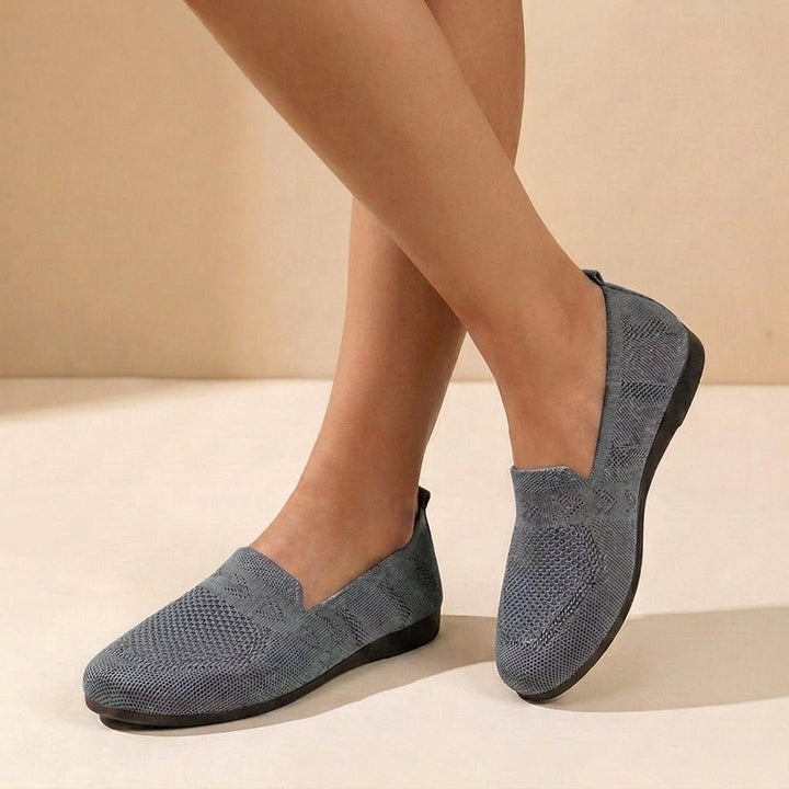Elegant women's round toe slip-on flats with subtle geometric detail, orthopedic comfort shoes for support.