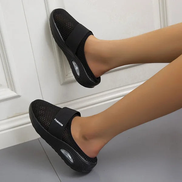 Women's orthopedic slip-on sandals with arch support for breathable all-day comfort & foot pain relief.