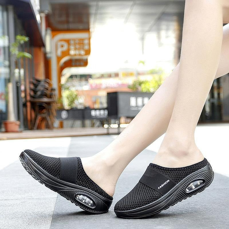 Stylish women's orthopedic slip-on shoes on a model. Arch support for comfortable walking.