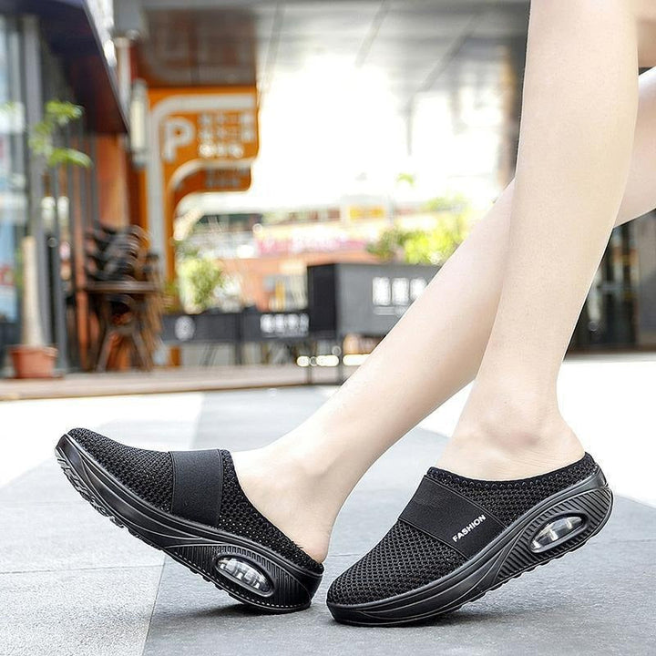 Stylish women's orthopedic slip-on shoes on a model. Arch support for comfortable walking.