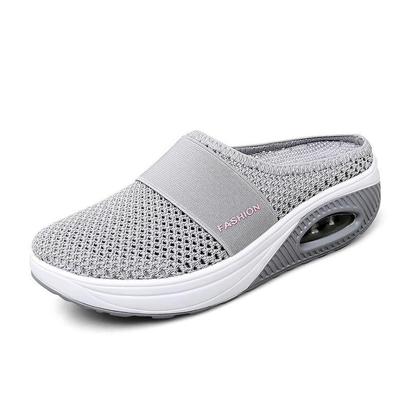 Flexible women's slip-on comfort shoes on model. Cushioned & ergonomic for all-day foot health.