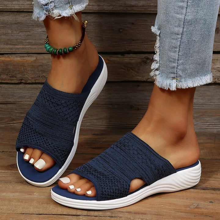 Casual women's slip-on slides with wide strap, perfect for comfortable summer everyday wear.