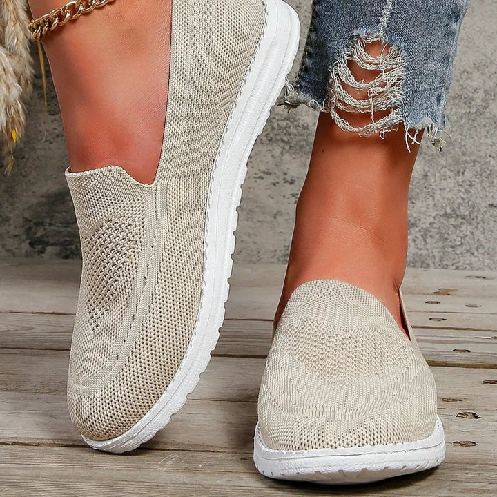 Lightweight women's slip-on walking trainers with arch support, perfect for everyday comfort.