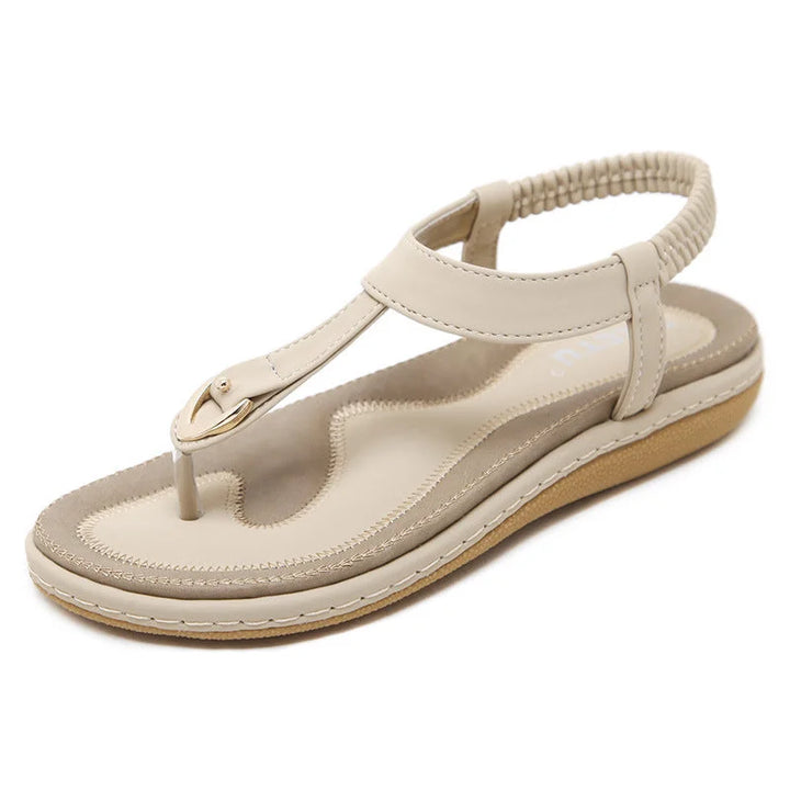 Women's T-strap flat sandals, orthopedic, with elastic strap & arch support for comfort.