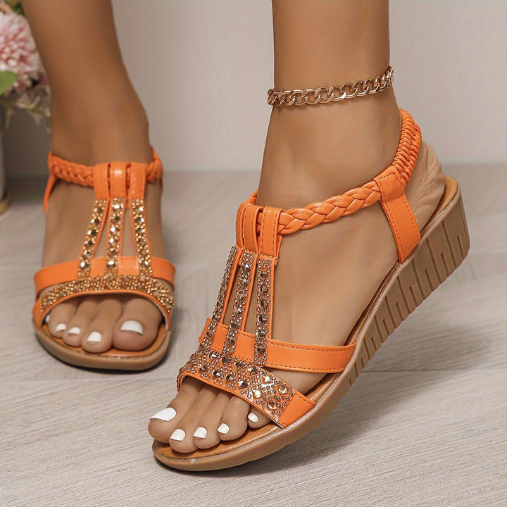 Comfortable orthopedic sole of women's T-strap wedge sandals, with stylish embellishments.