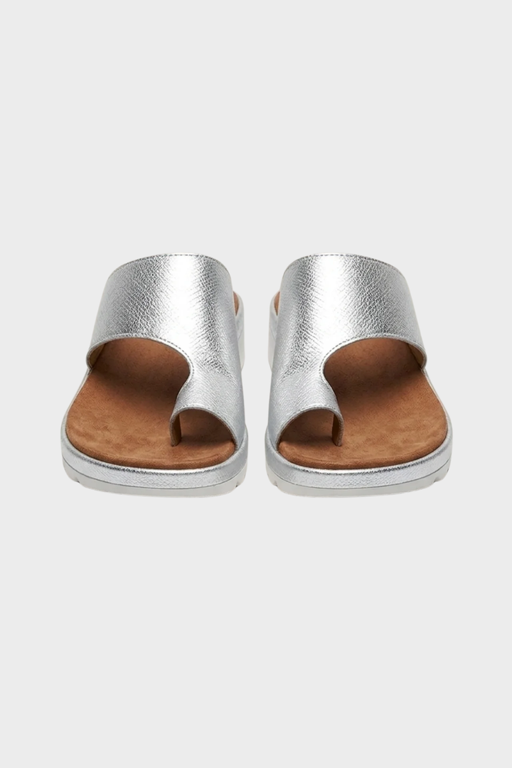 Orthopedic women's summer sandals, designed with a toe-post and arch support for walking.