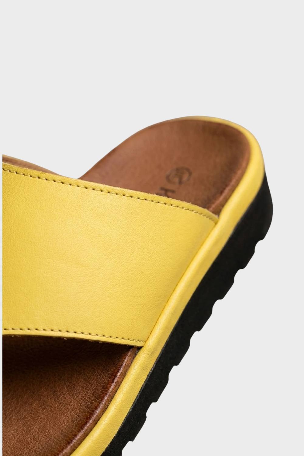Stylish women's orthopedic sandals with toe-post design and arch support for active comfort.
