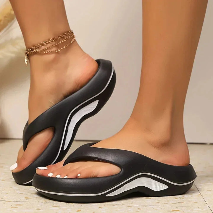 Comfort-focused women's orthopedic slides. Two-tone design, chunky platform sole for support & style.